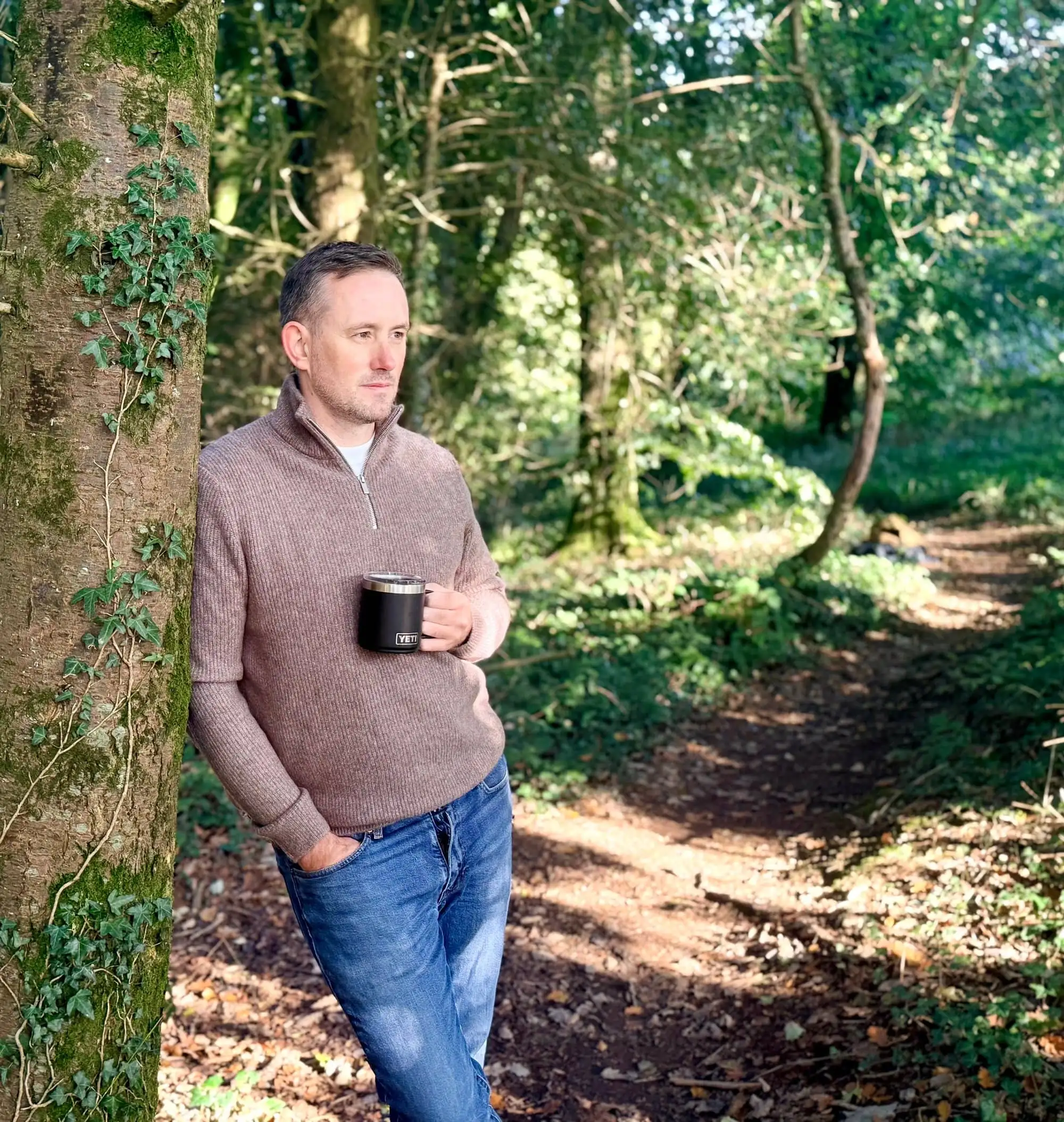 Nick Thorpe walking through woodland